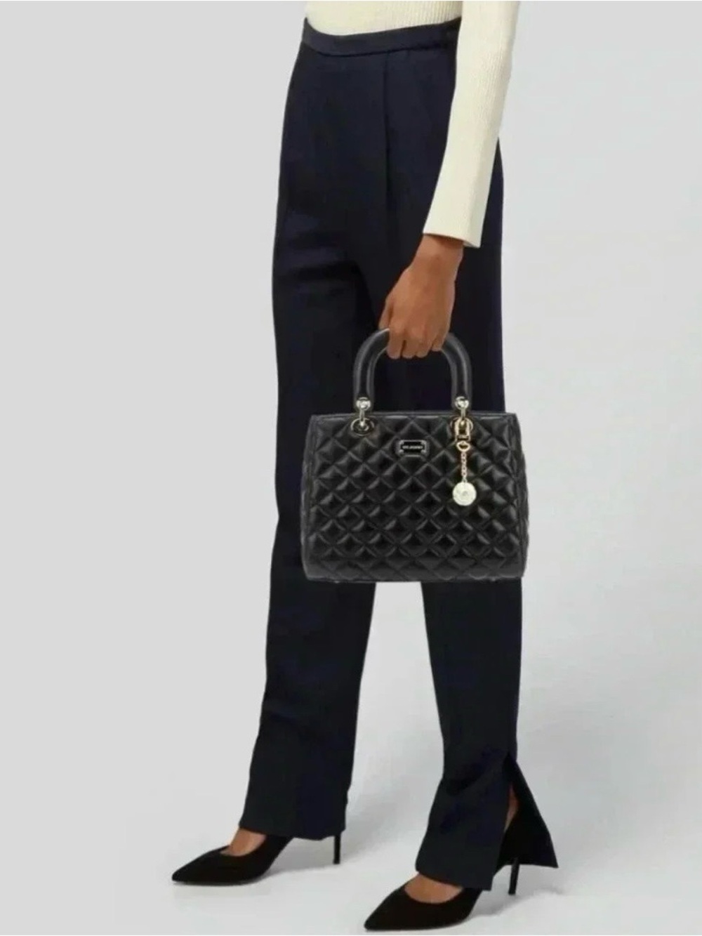 St. John Women's Black Leather Quilted Handbag
Purse Gold Tone hardware w/ Charm